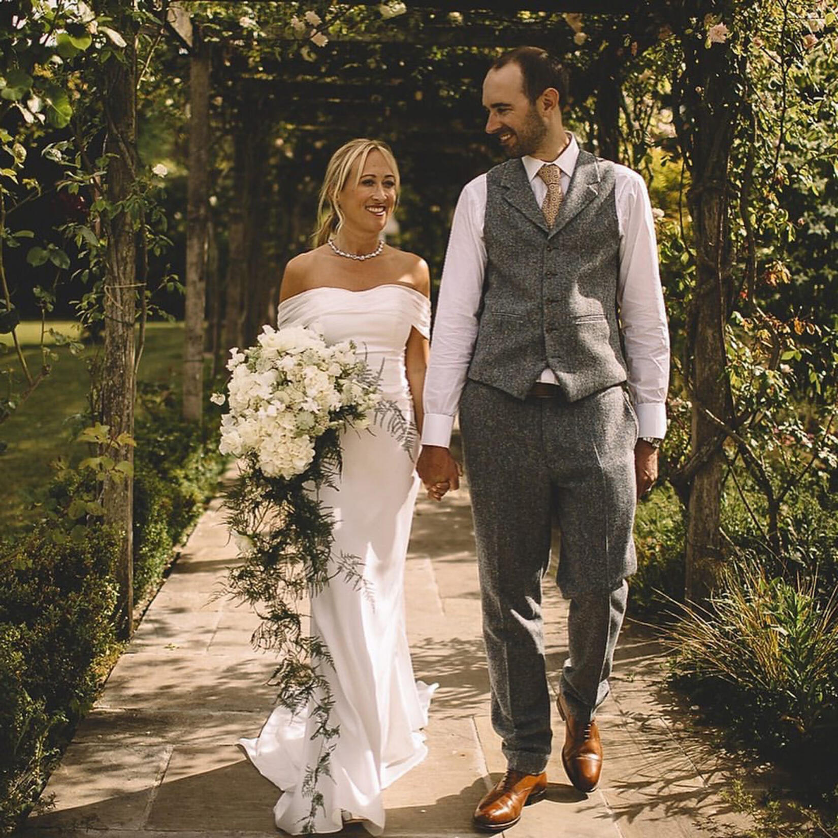 An image of the wedding couple walking together