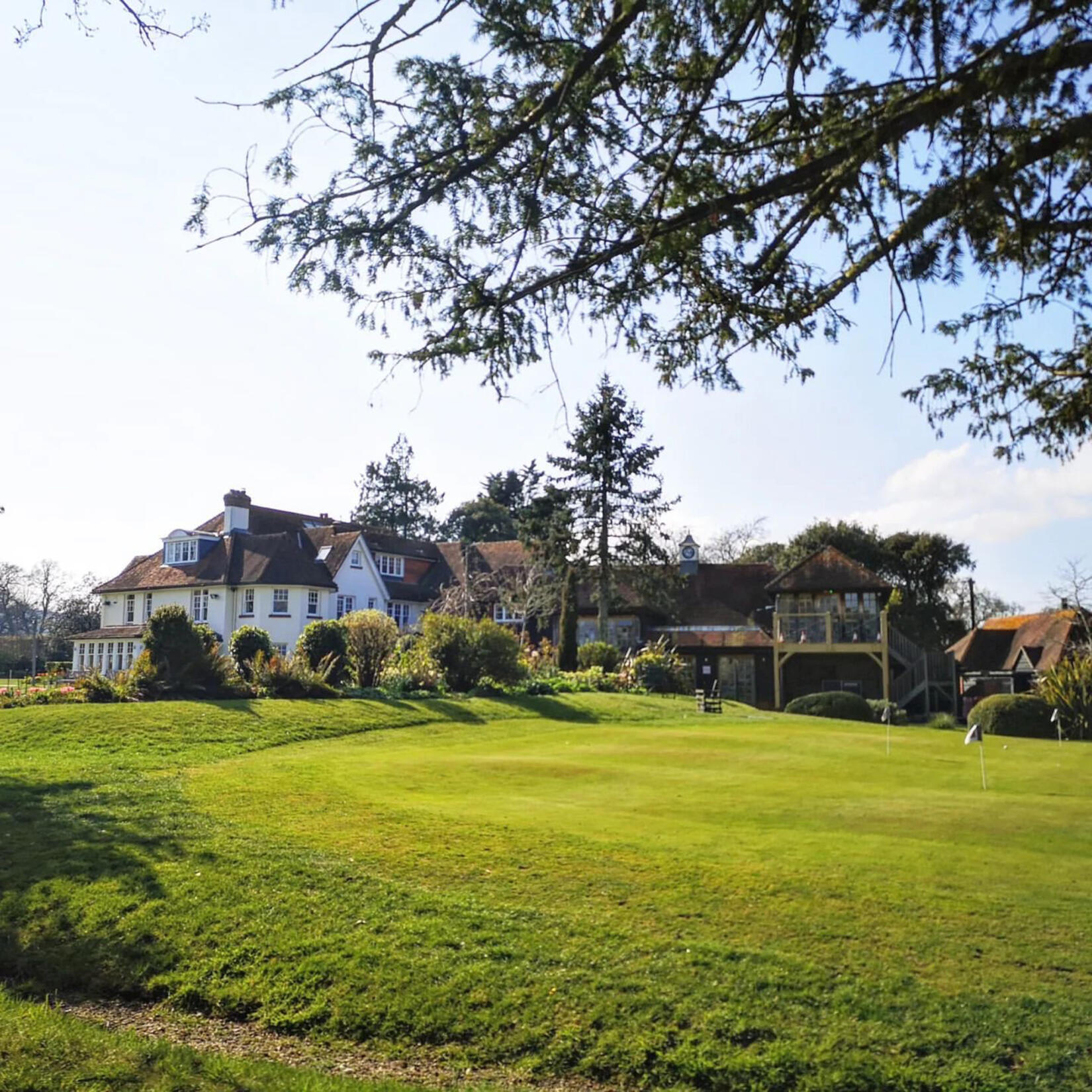An image of the main house and golf course