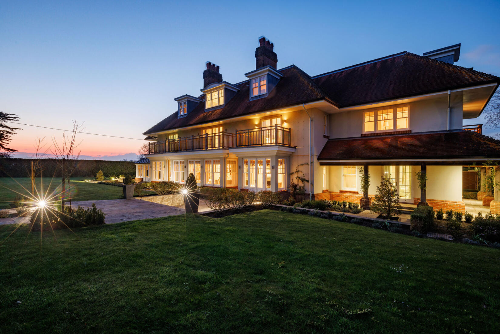 An image of the main house exterior at night