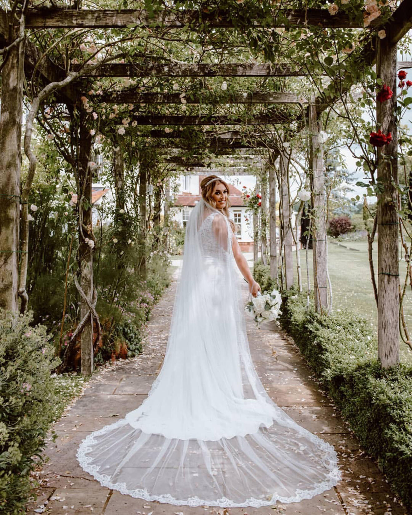 An image of a woman in a wedding dress outside
