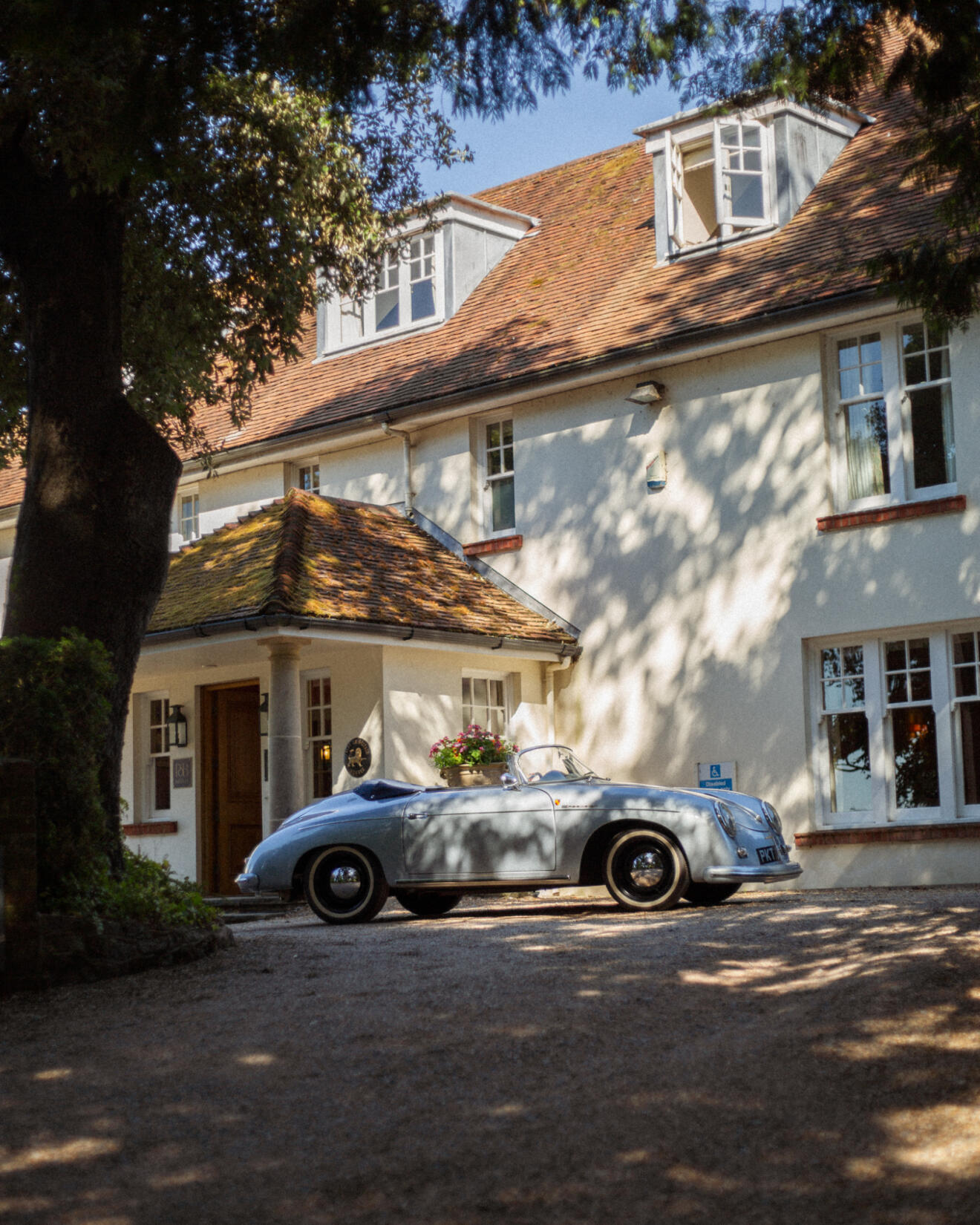 An image of the front of the main house and driveway